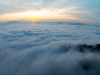 Drone aerial view of landscape fog over mountains in sunrise sky,High angle view over countryside at Southeast asia,Phang Nga Thailand,Wide angle view nature landscape