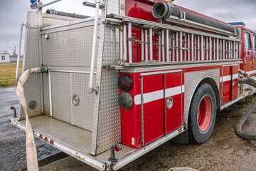 A fire truck for delivering firefighters to the fire site and supplying fire extinguishing agent....