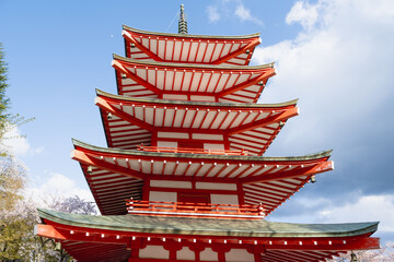 Fujiyoshida, Yamanashi, Japan - APR 17, 2024: Arakura Fuji Sengen Jinja Shrine. Mt Fuji with red pagoda in cherry blossom sakura in spring season .