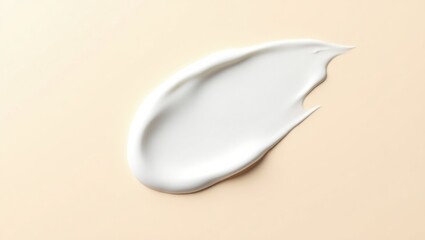 Cosmetic smears of creamy texture on a surface backdrop.