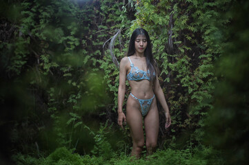 woman in bikini. woman in white bikini in forest	