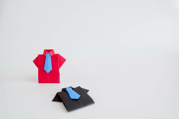 Business Concept Battle, Red Suit Wins, Black Suit Loses.
