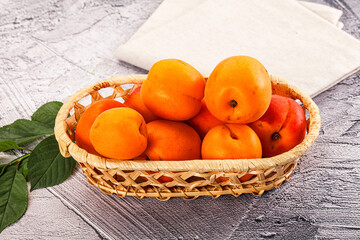 Raw ripe sweet apricots heap