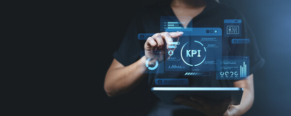 Businesswoman interacting with KPI interface.