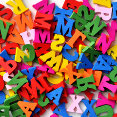 banner on the topic of "learning English" with bright letters of the alphabet