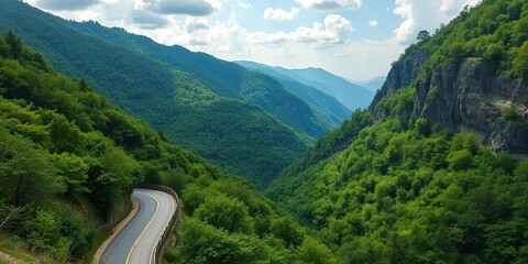 Winding mountain road, lush green foliage, scenic West Virginia vista, mountains, autumn