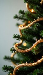 Sparkling garland wrapped around Christmas tree, decoration, bow, weave