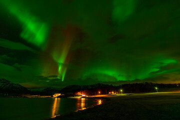 Elsgnes, Harstad, Hinnøya, Norway - 25 February 2025 - Night view of Elsgnes beach with Northern Lights