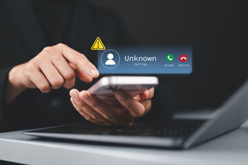 Scam or spam alert calls, Woman receiving unknown caller notification with a Warning Messages to Prevent Scams, Fraud, and Identity Theft on smartphone, Mobile Security Against Cybercrime.