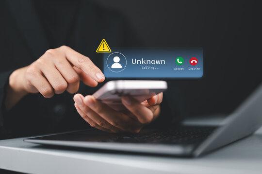 Scam or spam alert calls, Woman receiving unknown caller notification with a Warning Messages to Prevent Scams, Fraud, and Identity Theft on smartphone, Mobile Security Against Cybercrime.