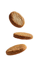 Obraz premium A trio of oat cookies float against a stark backdrop showcasing their rustic texture and warm inviting color Suspended treat