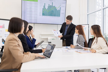 Group of business people working plan analysis at desk in modern office, Documents discussion analysis data the charts graphs, Business financial information and accountant concept.