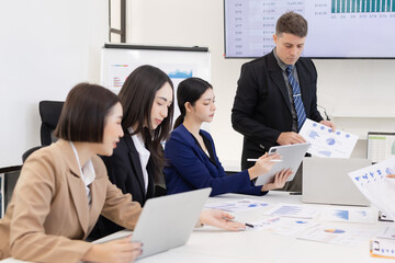 Group of business people working plan analysis at desk in modern office, Documents discussion analysis data the charts graphs, Business financial information and accountant concept.