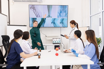 Team of doctor with human model and orthopedic surgeon, Healthcare and medical concept.