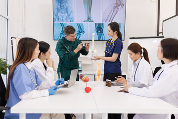 Fototapeta premium A group of doctors working together as a team in a hospital or clinic, Orthopedist doctor team, Healthcare and medical concept.
