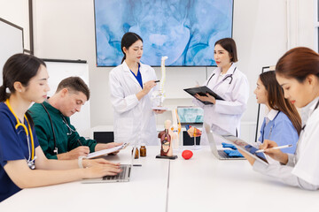 A group of doctors working together as a team in a hospital or clinic, Orthopedist doctor team, Healthcare and medical concept.