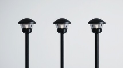 Three Elegant Black Outdoor Lanterns on Poles for Garden Pathway or Street Illumination