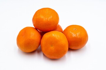 Ripe orange tangerines on a white background