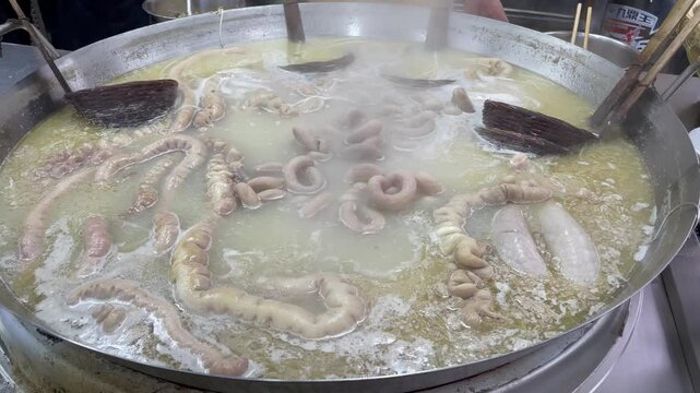 cooking pork chitterlings in a big pot