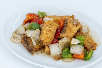 Sea Bass in black peppercorn, Stir fried Fish fillet with black pepper sauce, Stir Fried Sea Bass with Black Pepper. Boneless fish fried until crispy, stir-fried with sauce
