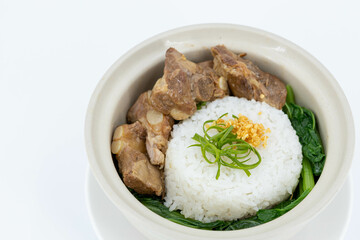 Braised Pork Ribs Rice Bowl on white background, Baked Pork Spare Ribs with Rice, Braised pork ribs rice bowl presented in white ceramic bowl, Asian-style braising sauce, Thaifood