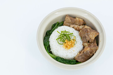 Braised Pork Ribs Rice Bowl on white background, Baked Pork Spare Ribs with Rice, Braised pork ribs rice bowl presented in white ceramic bowl, Asian-style braising sauce, Thaifood
