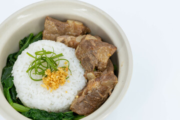 Braised Pork Ribs Rice Bowl on white background, Baked Pork Spare Ribs with Rice, Braised pork ribs rice bowl presented in white ceramic bowl, Asian-style braising sauce, Thaifood