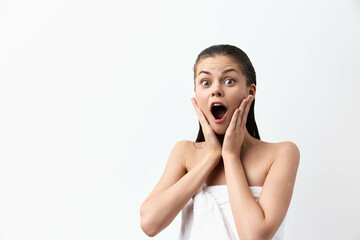 surprised expression, woman with towel, shocked reaction, white background, skincare concept,...
