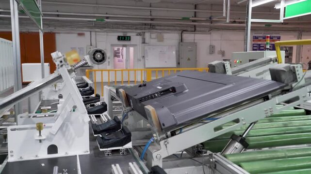 Conveyor summer assembly of LCD monitors and TVs