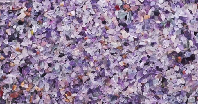 Top view of stack of polished multicolored Fluorite chips turning 360&deg;.