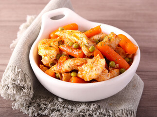 Chicken breast with carrot and peas