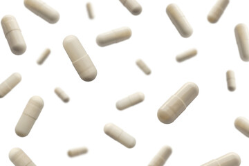 Falling white medicine pills capsule isolated on white background