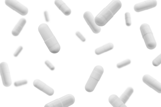 Falling white medicine pills capsule isolated on white background