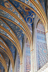 Interior details of Sainte-Secile gothic cathedral with intricate arches and vibrant frescoes,...
