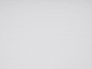 A pristine white canvas of paper, textured with subtle lines, suggests a quiet, understated elegance