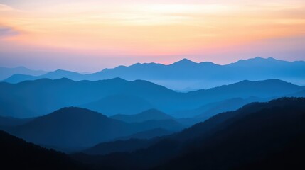 Obraz premium Serene sunset over majestic mountains.