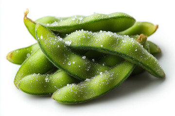 Edamame pods sprinkled with sea salt on a white background for a healthy snack option