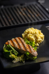 tuna fish steak with couscous and salad