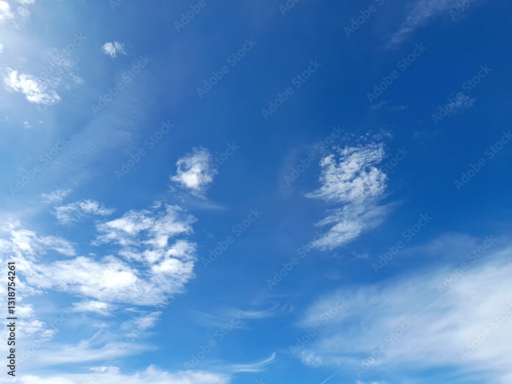 Wall mural cirrus clouds a slightly cloudy sky.