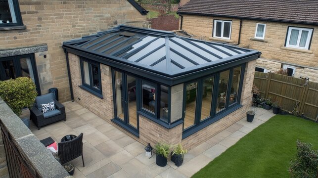 A stylish kitchen extension with a lightweight, durable fiberglass roof enhancing brightness.