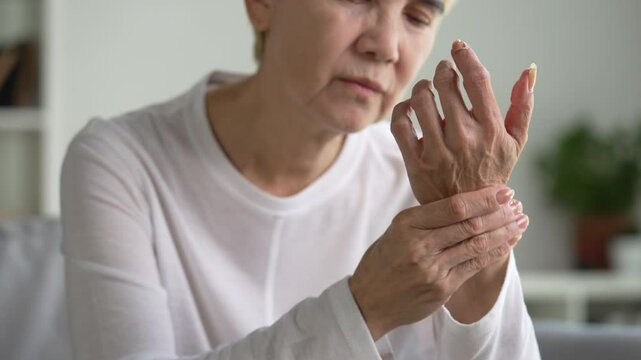 Senior woman suffering from wrist pain