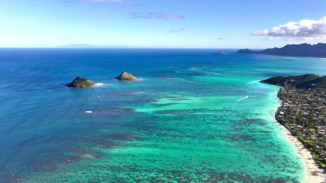 Moke Islands (Mokulua) and Lanikai Beach view from Pillbox Trail hike in Lanikai with Waimanalo in the background