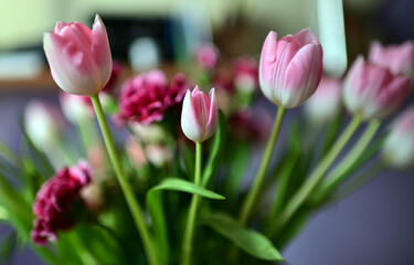 a bouquet of colorful roses and tulips