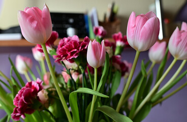 a bouquet of colorful roses and tulips