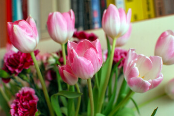 a bouquet of colorful roses and tulips