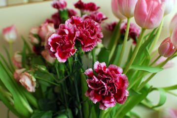 a bouquet of colorful roses and tulips