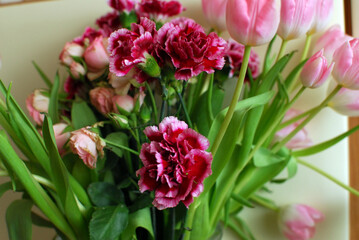 a bouquet of colorful roses and tulips