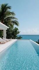 Fototapeta premium Luxurious tropical oceanfront villa with infinity pool, palm trees, and serene blue skies — perfect for a tranquil vacation escape.