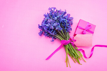 Mother day gift. Fresh blue purple hyacinths flowers bouquet and a gift box