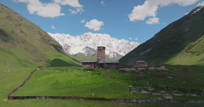 Ushguli is one of the highest settlements in Europe. Surrounded by the Caucasus Mountains, the village is notable for its stone tower houses and medieval architecture. Drone rises to the tower.